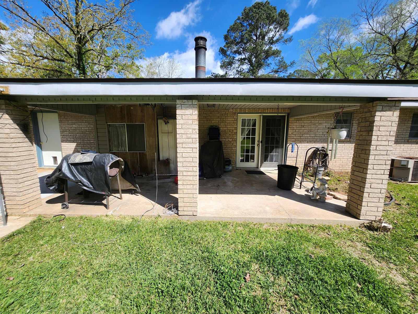 Back patio of brick home after cleaning