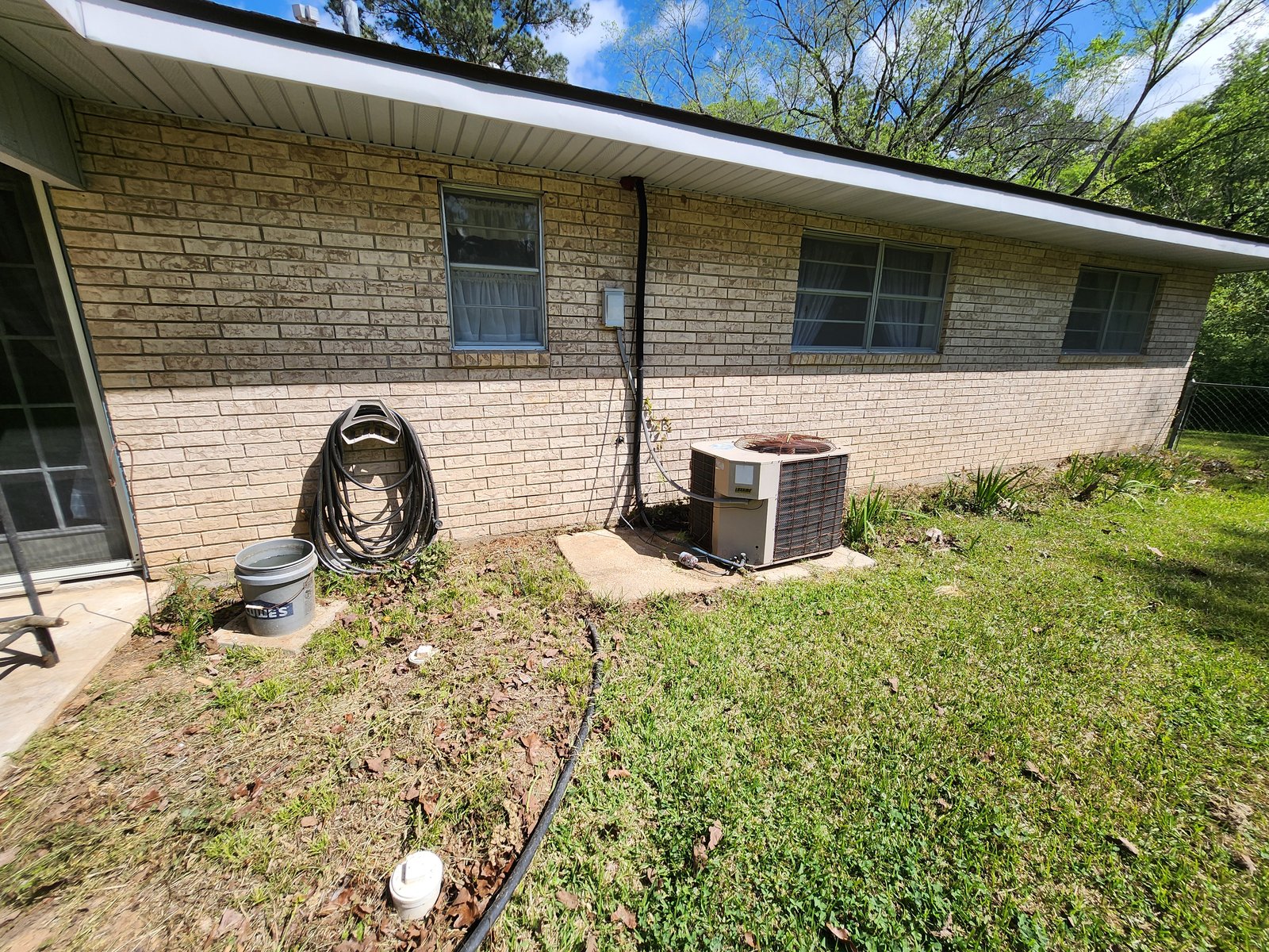Wide-angle view of clean brick home
