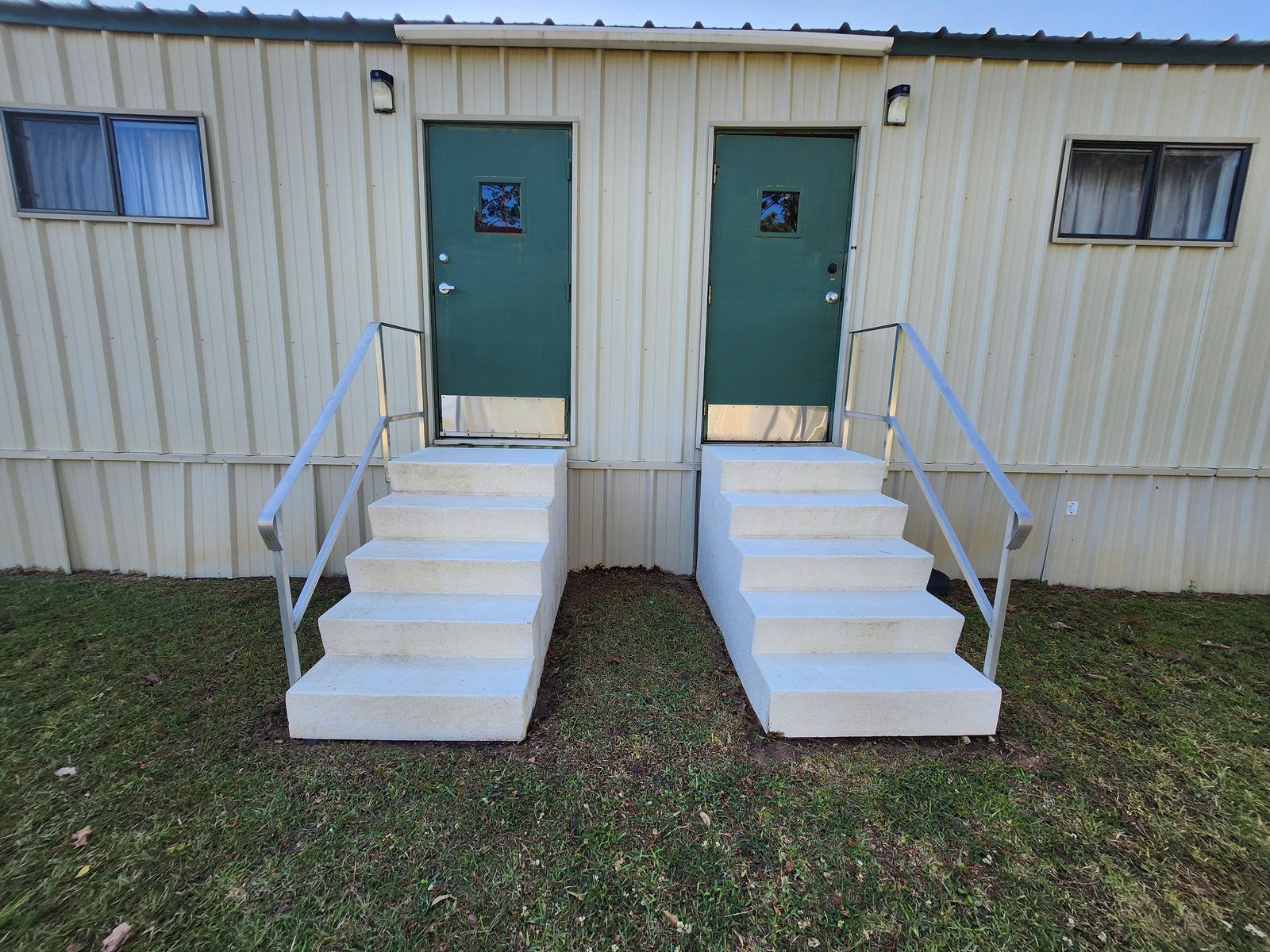 Modular commercial building with green doors after cleaning
