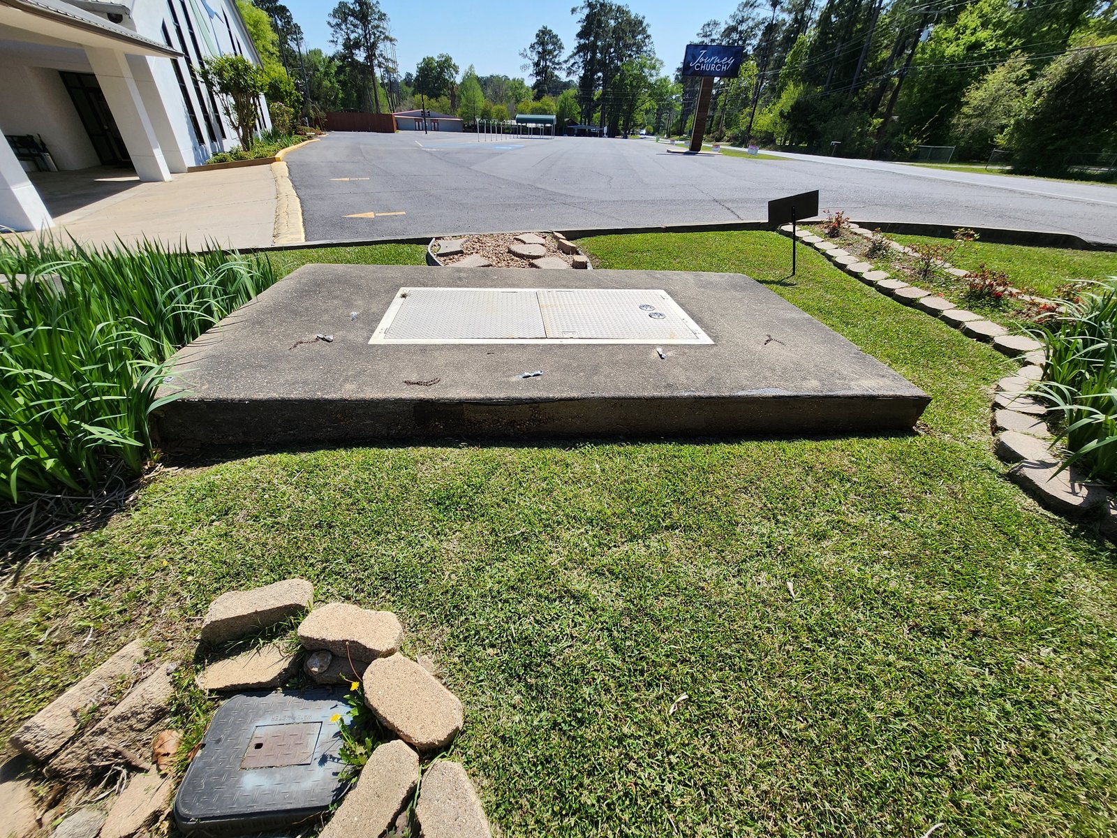 Concrete utility pad with algae and embedded dirt